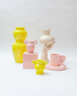 yellow and pink stoneware standing on a studio floor Logo Progressive Present