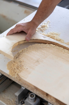 close-up of a wooden workpiece Logo Progressive Present