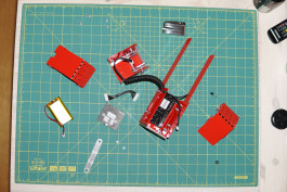 red metal parts of a lamp Logo Progressive Present