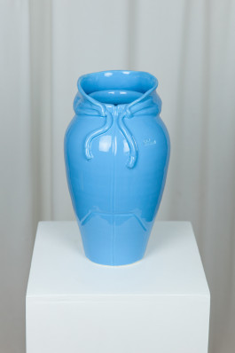 Blue vase in the shape of a hoodie Logo Progressive Present