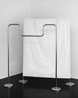 silver metal clothes rack Logo Progressive Present