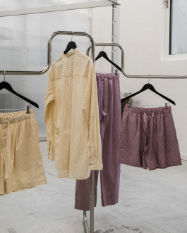 Clothing on a silver hanger Logo Progressive Present