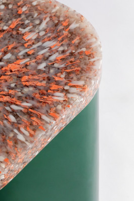 detail shot of a side table with a sprinkled plastic top Logo Progressive Present